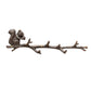 Coat rack with squirrel on branch
